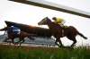 JOHN WOODS / WINNIPEG FREE PRESS
Richard Mangalee and Rigo Sarmiento finish race 1 at Assiniboia Downs Monday. The Downs is opening their race season tonight with an empty grandstand.