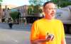 Robb Walvatne holds rocks thrown at police officers Saturday evening. He was part of dozens of volunteers who helped clean up downtown Fargo early Sunday. C.S. Hagen / Fargo Forum