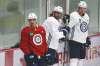 THE CANADIAN PRESS/John Woods
Winnipeg Jets' Luca Sbisa, left, at practice with Blake Wheeler and Mark Scheifele, spent most of the NHL pause in California.