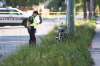 MIKE DEAL / WINNIPEG FREE PRESS
A Winnipeg police officer surveys the scene near Moncton Avenue and Grey Street after a cyclist was injured in a hit-and-run. The 50-year-old man died later in hospital.