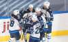 Jansen Harkins (centre) scored a goal against the Calgary Flames on Monday. (Jason Franson / The Canadian Press)