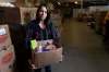 JESSE BOILY / WINNIPEG FREE PRESS
Meaghan Erbus, advocacy and impact manager at Winnipeg Harvest, shows a hamper at the Winnipeg Harvest warehouse.