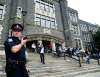 A Toronto police officer in front of Central Technical School in Toronto in 2010. In 2017 the Toronto District School Board voted to axe its decade-old, onsite police program. THE CANADIAN PRESS/Nathan Denette