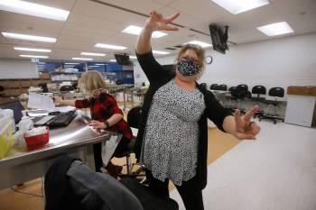 John Woods / The Canadian Press files
Registered nurse Sherry Plett celebrates after receiving her first COVID-19 inoculation — the second in Manitoba — from Danielle Kim, public health nurse.