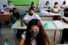 (AP Photo/Petros Karadjias)
Manitoba has mandated the use of non-medical masks for students in Grade 4 and up, staff and all visitors in schools, when two metres of physical distancing is not possible.