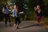 JESSE BOILY / WINNIPEG FREE PRESS
From left, Leanne Lucas, Lindsay Somers and Sarah Wilton have a warm-up dance before their run at The Forks. Somers started her Learn to Run outdoor programs in 2017.