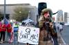 Dario Lopez-MIlls / The Associated Press
A QAnon believer speaks to a crowd of Trump-supporting protesters outside of the Maricopa County recorder’s office in Phoenix on Nov. 5.