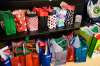 Daniel Crump / Winnipeg Free Press. Christmas gifts are lined up for participants at the Rossbrook House childcare programs. Because of the pandemic and shopping restrictions each gift bag contains creative DIY crafts that use essential items still being sold in stores. December 16, 2020.