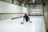 Aaron van Ryssel tests out his family’s new curling sheet built inside a storage barn on their farm. (Rosanna Hempel / Winnipeg Free Press)