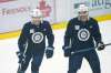 Winnipeg Jets' Mason Appleton, left, and Adam Lowry share a laugh during their NHL training camp in Winnipeg. THE CANADIAN PRESS/John Woods