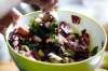 Emily Butcher prepares a panzanella in her home. (John Woods / Winnipeg Free Press)