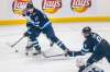 Adam Lowry (left) has been on a tear. He is on a six-game points streak heading into tonight&rsquo;s game vs. the Flames. (Mikaela MacKenzie / Winnipeg Free Press files)