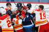 JOHN WOODS / WINNIPEG FREE PRESS
Calgary Flames' Sam Bennett, left, and Matthew Tkachuk rough up Winnipeg Jets' Adam Lowry Tuesday in one of the few moments of animosity between the two teams during their back-to-back series.