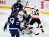 John Woods / The Canadian Press
Winnipeg Jets goaltender Connor Hellebuyck (37) saves the shot as Ottawa Senators&rsquo; Derek Stepan (21) and Colin White (36) attack during first period NHL action in Winnipeg on Thursday.