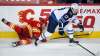 Winnipeg Jets centre Pierre-Luc Dubois (right) dodged a check from Calgary Flames winger Milan Lucic in Calgary on Tuesday, but tweaked something in the following game against Ottawa on Thursday. (Jeff McIntosh / The Canadian Press files)