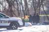 MIKAELA MACKENZIE / WINNIPEG FREE PRESS
Police investigate at the scene of a fatal fire at an encampment on Higgins Avenue in Winnipeg on Tuesday.