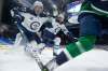 Winnipeg Jets' Nikolaj Ehlers (27) and Tucker Poolman (3) chase down Vancouver Canucks' Brock Boeser during the third period of an NHL hockey game in Vancouver on Friday. “We’re competitive guys. There’s always some kind of competition between everyone,