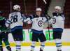 Blake Wheeler and Mark Scheifele celebrate with Pierre Luc Dubois after Dubois scored his first goal with the Winnipeg Jets during the second period against the Vancouver Canucks in Vancouver, Sunday. (TREVOR HAGAN / WINNIPEG FREE PRESS)