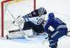 Winnipeg Jets goaltender Connor Hellebuyck makes a save on a breakaway against Toronto Maple Leafs right wing Mitchell Marner during the third period in Toronto on Tuesday. THE CANADIAN PRESS/Nathan Denette