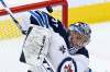 Winnipeg Jets goaltender Connor Hellebuyck makes a stop against the Toronto Maple Leafs during the first period in Toronto on Thursday. THE CANADIAN PRESS/Frank Gunn
