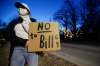 Protesters gathered outside Manitoba Premier Brian Pallister’s house on Wellington Crescent to protest the government’s proposed Bill 64 in Winnipeg Monday. (John Woods / Winnipeg Free Press)