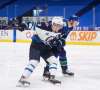 Winnipeg Jets' Andrew Copp is checked by Vancouver Canucks' Tyler Myers during the first period. THE CANADIAN PRESS/Darryl Dyck