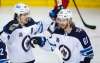 Jeff McIntosh / The Canadian Press
Mark Scheifele, left, celebrates his goal with teammate Kyle Connor during the second period.