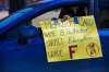 A motorist gives Premier Brian Pallister a failing grade during a honk-a-thon protest outside the legislature Wednesday. (Mikaela MacKenzie / Winnipeg Free Press)