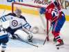 Winnipeg Jets goaltender Connor Hellebuyck makes a save on Montreal Canadiens' Eric Stall during the second period. THE CANADIAN PRESS/Ryan Remiorz