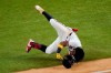 Atlanta Braves' Ronald Acuna Jr. falls at first base during the sixth inning in Game 4 of a baseball National League Championship Series against the Los Angeles Dodgers Thursday, Oct. 15, 2020, in Arlington, Texas. (AP Photo/Sue Ogrocki)