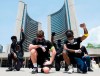 Protesters raise their fists at an anti-racism demonstration reflecting anger at the police killings of black people, in Toronto on Friday, June 5, 2020. THE CANADIAN PRESS/Nathan Denette