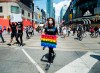 A protester holds a sign as thousands of people protest at an anti-racism demonstration reflecting anger at the police killings of black people, in Toronto on Friday, June 5, 2020. THE CANADIAN PRESS/Nathan Denette