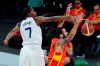 United States' Kevin Durant (7) blocks a shot by Spain's Ricky Rubio (9) during the first half of an exhibition basketball game in preparation for the Olympics, Sunday, July 18, 2021, in Las Vegas. (AP Photo/John Locher)