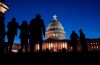 FILE - In this Jan. 22, 2020 file photo, night falls on the Capitol, in Washington. For many Americans, how they feel about issues raised during President Donald Trump's impeachment has much to do with where they get their news. That's among the findings of a study out Friday, Jan. 24, by the Pew Research Center. (AP Photo/J. Scott Applewhite, File)