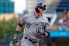 FILE - In this Monday, Aug. 5, 2019 file photo, Milwaukee Brewers' Christian Yelich rounds third after hitting a solo home run off Pittsburgh Pirates starting pitcher Dario Agrazal during the first inning of a baseball game in Pittsburgh. The Milwaukee Brewers have a lot of work to do in spring training. Having Christian Yelich sure helps. Yelich was working on a strong case for his second straight NL MVP award last year when he broke his right kneecap in September, sidelining the All-Star slugger for the rest of the season. (AP Photo/Gene J. Puskar, File)