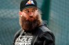 FILE - In this Sept. 11, 2019, file photo, Colorado Rockies right fielder Charlie Blackmon waits to enter the batting cage before the team's baseball game against the St. Louis Cardinals in Denver. All-Star outfielder Charlie Blackmon of the Colorado Rockies has become the first Major League Baseball player known to have tested positive for the coronavirus. A person familiar with Blackmon’s situation confirmed the test result to The Associated Press on condition of anonymity because there was no official announcement. (AP Photo/David Zalubowski, File)