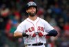 FILE - In this Tuesday, April 9, 2019 file photo, Boston Red Sox's Dustin Pedroia takes off his gloves after lining out to right field to end the sixth inning of the home opener baseball game against the Toronto Blue Jays in Boston. Red Sox second baseman Dustin Pedroia had what the team called a 