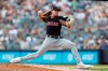 FILE - In this Aug. 18, 2019, file photo, Cleveland Indians' starting pitcher Mike Clevinger winds up during the first inning of a baseball game against the New York Yankees, in New York. Clevinger will undergo left knee surgery after injuring himself during a spring training workout. The team said Friday, Feb. 14, 2020, that Clevinger, who went 13-4 last season, suffered a partial tear of meniscus during a workout at the team's complex in Goodyear, Arizona on Wednesday.(AP Photo/Kathy Willens, File)