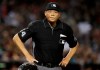 FILE - In this June 2, 2018, file photo, Major League baseball umpire Kerwin Danley (44) is shown during the first inning of a baseball game between the Arizona Diamondbacks and the Miami Marlins in Phoenix. Danley became the first African-American umpire crew chief in Major League Baseball during a series of retirements, promotions and additions announced Wednesday, Feb. 26, 2020. (AP Photo/Rick Scuteri, File)