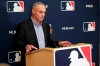 FILE - In this Feb. 6, 2020, file photo, Baseball Commissioner Rob Manfred answers questions at a press conference during baseball owners meetings in Orlando, Fla. Manfred tells The Associated Press that the commissioner's office, teams and the players' association 