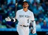 FILE - In this Wednesday, April 11, 2018 file photo, Colorado Rockies' Carlos Gonzalez tosses his bat after striking out against San Diego Padres relief pitcher Phil Maton to end the sixth inning of a baseball game in Denver. The Mariners are adding depth to their outfield. agreeing Tuesday, Feb. 11, 2020 to a minor league contract with former All-Star Carlos González, according to a person with knowledge of the deal. (AP Photo/David Zalubowski, File)