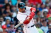 FILE - In this Aug. 10, 2019, file photo, Boston Red Sox's Mookie Betts hits an RBI-double during the sixth inning of a baseball game against the Los Angeles Angels in Boston. Betts has agreed to a $27 million contract with the Red Sox. It is the largest one-year salary for an arbitration-eligible player. (AP Photo/Michael Dwyer, File)