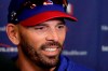 FILE - In this Feb. 14, 2020, file photo, Texas Rangers manager Chris Woodward talks to the media during spring training baseball practice in Surprise, Ariz. Woodward was going to have a team meeting before the start of summer camp, just like he did before spring training about 4 1/2 months ago. This time, it was a Zoom call. (AP Photo/Charlie Riedel, File)