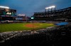 FILE - In this Sept. 9, 2020, file photo, Citi Field is viewed at dusk before a baseball game between the New York Mets and the Baltimore Orioles in New York. Billionaire hedge fund manager Steve Cohen has agreed to purchase the Mets from the Wilpon family. The team announced the agreement on Monday, Sept. 14, 2020. The deal is subject to the approval of Major League Baseball owners. (AP Photo/Kathy Willens, File)