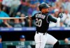 FILE - In this July 29, 2019, file photo, Colorado Rockies' Ian Desmond follows the flight of his triple off Los Angeles Dodgers starting pitcher Kenta Maeda in the second inning of a baseball game in Denver. Desmond plans to sit out this season to be with his family and help the youth baseball program in his hometown in Florida. The 34-year-old Desmond wrote on Instagram that the “COVID-19 pandemic has made this baseball season one that is a risk I am not comfortable taking.” (AP Photo/David Zalubowski, File)