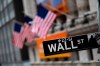 FILE - This Jan. 31, 2020, file photo shows a Wall Street sign in front of the New York Stock Exchange. (AP Photo/Mark Lennihan, File)