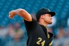 FILE - In this Aug. 20, 2019, file photo, Pittsburgh Pirates starter Chris Archer pitches against the Washington Nationals in the first inning of a baseball game in Pittsburgh. Archer’s $11 million option for 2021 has been declined by the Pirates, making the 32-year-old right-hander eligible for free agency. Archer will receive a $250,000 buyout, completing a contract he agreed to with Tampa Bay in April 2014. (AP Photo/Keith Srakocic, File)