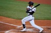 FILE - In this Sept. 2, 2020, file photo, Miami Marlins' Starling Marte bats during the third inning of the team's baseball game against the Toronto Blue Jays in Miami. Marte is staying with the Marlins after the team exercised its $12.5 million contract option for next year. Miami decided to pick up Marte’s option rather than pay him a $1 million buyout. The move Tuesday, Oct. 27, prevents Marte from becoming a free agent this offseason. (AP Photo/Wilfredo Lee, File)