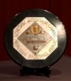 FILE - In this Jan. 22, 2006, file photo, a Joe DiMaggio 1947 MVP Award plaque is displayed at a news conference in New York. The plaque features the name and image of Kenesaw Mountain Landis. The name of Landis, the former baseball commissioner who never had a Black player in the majors during his long reign, is being pulled off all future MVP plaques after more than 75 years. Landis won't be depicted on the annual awards presented by the Baseball Writers’ Association of the America, the group said Friday, Oct. 2, 2020. The decision came after 89% of its membership voted this week for removal. (AP Photo/Jennifer Szymaszek, File)