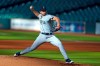 FILE - In this July 27, 2020, file photo, Seattle Mariners starting pitcher Kendall Graveman throws to a Houston Astros batter during the first inning of a baseball game in Houston. Graveman and the Mariners agreed to a $1.25 million one-year contract Thursday, Oct. 29, after the team declined his $3.5 million option in favor of a $500,000 buyout. Graveman agreed last year to a $2 million deal that included a $1.5 million salary for 2020 plus the option year. He earned $555,556 in prorated pay. (AP Photo/David J. Phillip, File)